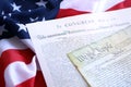 Constitution of the USA with US flag. Aged historical documents Royalty Free Stock Photo