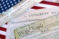 Constitution of the USA with US flag. Aged historical documents Royalty Free Stock Photo