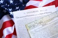 Constitution of the USA with US flag. Aged historical documents Royalty Free Stock Photo