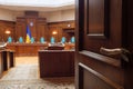 Constitutional Court of Ukraine law judge. Open door courtroom trial court of law justice symbol Ukraine court room