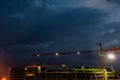 Constraction site with a crane at night