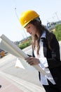 Construcion worker analyzing blueprints Royalty Free Stock Photo