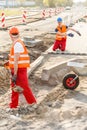 Construcion workers laying brick pavement Royalty Free Stock Photo