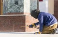 Construciton worker welding metal Rods