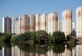 Constructed block of flats over river and clear blue sky in summer day