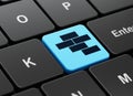Constructing concept: Bricks on computer keyboard background Royalty Free Stock Photo