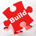 Constructing concept: Build on puzzle background Royalty Free Stock Photo