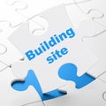 Constructing concept: Building Site on puzzle background Royalty Free Stock Photo