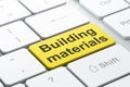Constructing concept: Building Materials on computer keyboard background Royalty Free Stock Photo