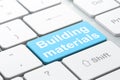 Constructing concept: Building Materials on computer keyboard background Royalty Free Stock Photo