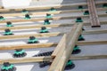 Constructing terracing wood adjustable plastic supports for creating a wooden deck terrace patio