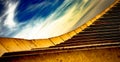 Construction, abstract yellow stairs and beautiful sky with white clouds Royalty Free Stock Photo