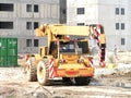 Construction activity in Maracay, Venezuela featuring a crane maneuvering on a building site Royalty Free Stock Photo