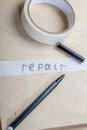 Construction adhesive tape, marker and inscription Royalty Free Stock Photo
