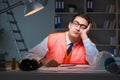 The construction architect working on drawings late at night Royalty Free Stock Photo