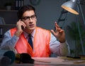 Construction architect working on drawings late at night Royalty Free Stock Photo