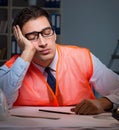 Construction architect working on drawings late at night Royalty Free Stock Photo