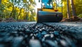 Construction of an asphalt highway road roller and machinery at work under a clear blue sky Royalty Free Stock Photo