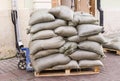 Construction bags on the pallets with loader. industrial, building. Royalty Free Stock Photo