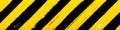 Construction banner. Yellow and black grunge stripes in diagonal
