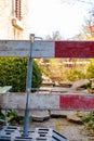 Construction barrier in front yard. Barricade for construction site of sewerage shaft