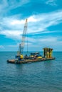 Construction at blue sea and a hydraulic suction dredger ship in Terengganu, Malaysia