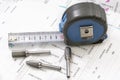 Construction blueprints with tools and measuring tape, roulette, closeup. With place for rext Royalty Free Stock Photo