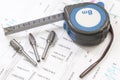 Construction blueprints with tools and measuring tape, roulette, closeup. With place for rext Royalty Free Stock Photo