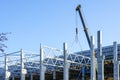 Construction of the body of a modern factory, assembly of metal trusses Royalty Free Stock Photo