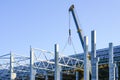 Construction of the body of a modern factory, assembly of metal trusses