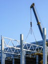 Construction of the body of a modern factory, assembly of metal trusses Royalty Free Stock Photo