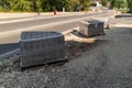 Construction of brick paved sidewalk, piles of packed pave stones