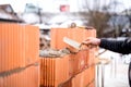 Construction bricklayer worker building walls with fresh bricks and tools Royalty Free Stock Photo