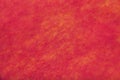 Bright red background of felt fabric. Texture of woolen textile Royalty Free Stock Photo