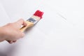 Construction brush in hand on white background. not isolated Royalty Free Stock Photo