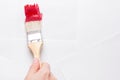 Construction brush in hand on white background. not isolated Royalty Free Stock Photo
