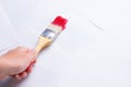 Construction brush in hand on white background. not isolated Royalty Free Stock Photo