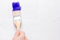 Construction brush in hand on white background. not isolated Royalty Free Stock Photo