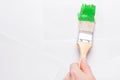 Construction brush in hand on white background. not isolated Royalty Free Stock Photo