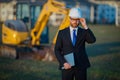 Construction builder manager or supervisor at a construction site. Portrait of construction manager worker in hardhat Royalty Free Stock Photo