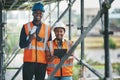 Construction, building and civil engineering team or on site workers with a tablet and plans. Portrait of contractors Royalty Free Stock Photo