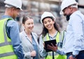 Construction, building and group with architect on tablet, project blueprint or engineering planning for work site Royalty Free Stock Photo