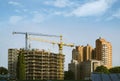 Construction building with hoisting tower crane