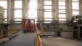 Construction of building interior of factory. Modern industrial building. Equipment and piping as found inside of