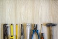 Construction, building and repair tools set for house work on wooden background. Top view. Royalty Free Stock Photo