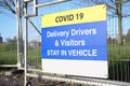 Construction building site Covid-19 health and safety sign for delivery driver Royalty Free Stock Photo