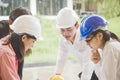 Construction building team. Female Architect and engineer working together at construction area