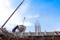 Construction building workers at construction site pouring concrete in form Royalty Free Stock Photo