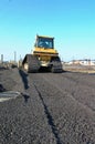 A construction bulldozer moving gravel Royalty Free Stock Photo