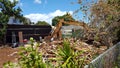 Construction Bulldozer tears down home of Lot in Kapahulu